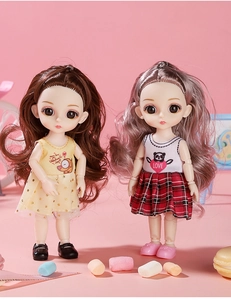 Detailed view of two BJD dolls in stylish outfits with cute colorful candy props