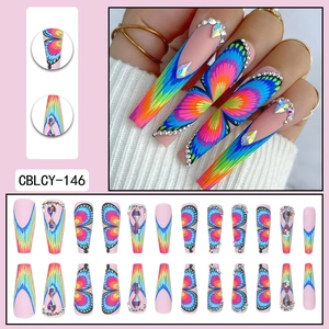 Rainbow butterfly press-on nails with rhinestones in a long coffin shape design