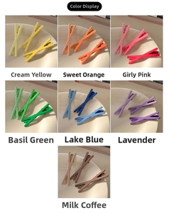 Set of matte finish bow hair clips in multiple candy colors shown on ceramic bowls