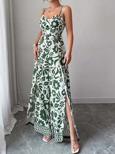 Detail of elegant green floral print jumpsuit featuring high side slits and airy fabric