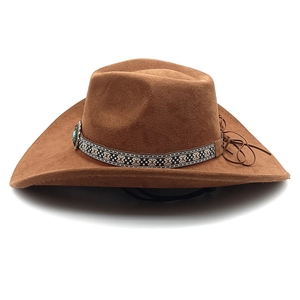 Detail of western cowboy hat with ethnic patterned band, turquoise buckle and fringe