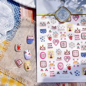 Macro detail of M-1140 nail art stickers featuring cute cartoon cats and strawberry icons