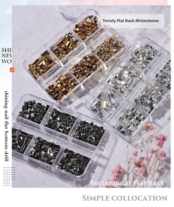 Close-up of rectangle flatback nail art rhinestones in 6-grid transparent storage boxes