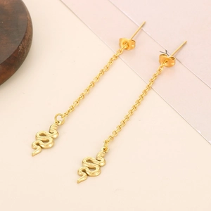 Detailed view of gold snake pendant earrings with a long textured chain design