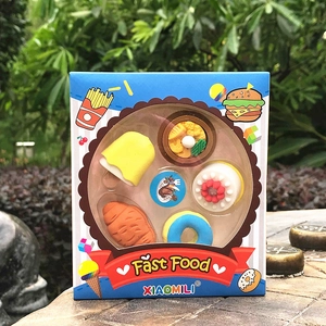Detail of fast food shaped erasers including pizza and cake in a window display box