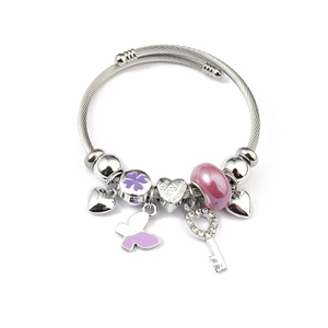 Detail of rope texture bracelet with purple flower, butterfly, and Valentine heart charms