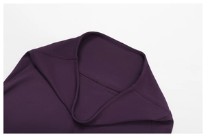 Detailed close-up of dark purple high-waisted yoga leggings with seamless stitching
