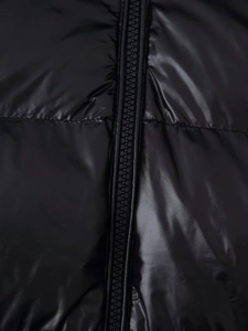 Detail view of glossy black padded jacket featuring high-quality zipper and shiny fabric