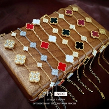 Detailed display of four-leaf clover bracelets with agate, mother of pearl and zircon