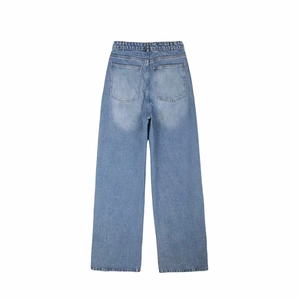 Detail view of high waist wide leg light blue jeans with dual back pockets and stitching