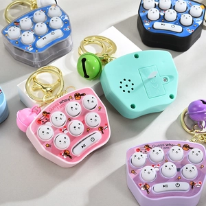 Detail showing colorful mini whack-a-mole game keychain in blue pink purple and green