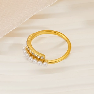 Detailed close-up of 18K gold plated ring featuring small white pearls and clear rhinestones