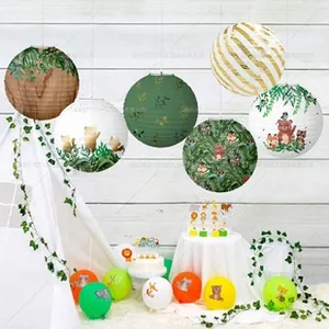 Detail of forest animal and leaf patterns on decorative paper lanterns for party decor