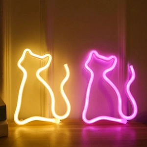 Neon cat silhouette wall lights in warm yellow and pink glow for room decoration