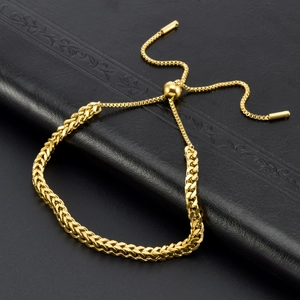 Adjustable gold-plated stainless steel woven chain bracelet on black leather backdrop
