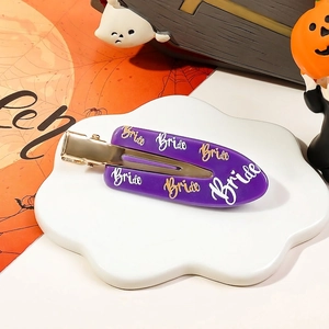 Macro view of purple Bride hair clip with gold metal duckbill clip for Halloween