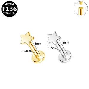 Macro detail of G23 titanium labret studs in star shape with 1.2mm 8mm thread size