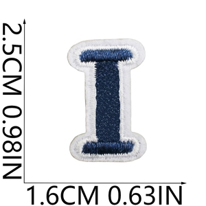 Mini navy blue letter I embroidered patch with white edges measuring 2.5cm by 1.6cm