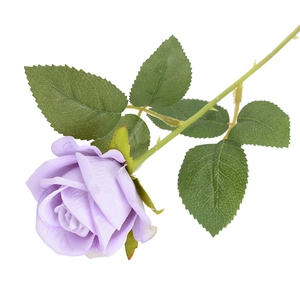 Single stem of light purple velvet artificial rose with green leaves on white background