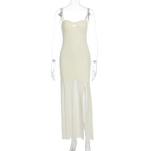 Detail of cream corset-style dress with gathered chest and sheer pleated mesh skirt hem