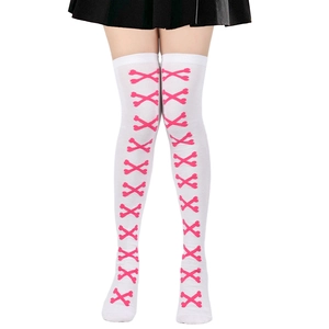 Detail of white over-knee socks featuring pink cross bone patterns and knitted texture