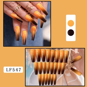 Detail of long coffin nails with yellow to dark brown gradient ombre effect, model LF547
