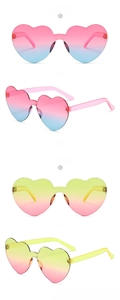 Macro view of frameless heart sunglasses with pink-blue and yellow-pink gradients