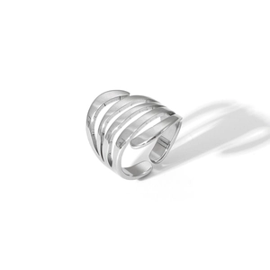 Macro shot of silver multi-layer striped irregular hollow open ring in polished steel