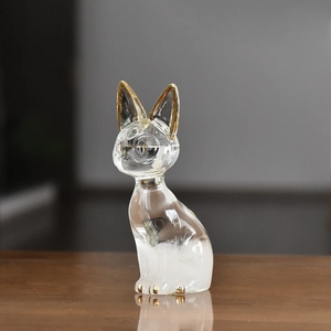 Cat-shaped glass storm bottle weather forecaster with gold accents and crystal texture