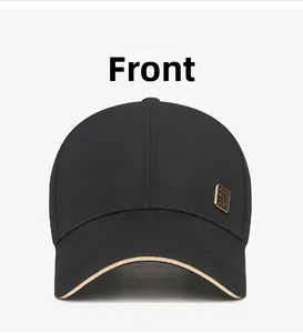 Front view of black mesh baseball cap with gold metal plate and khaki brim accent