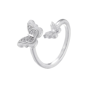 Macro detail of silver adjustable ring featuring dual butterfly design with cubic zirconia