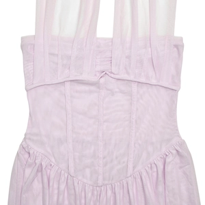 Detail of pink pleated tulle halter dress featuring a structured waist and mesh straps