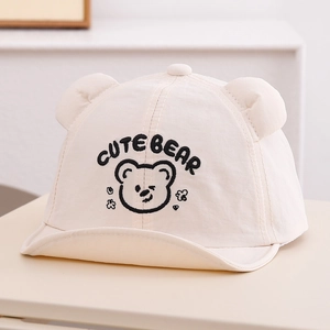 Detail of baby bear baseball cap showing 3D ears and cute embroidery on cotton canvas