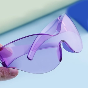 Close-up of purple oversized sports sunglasses with a streamlined wrap-around design
