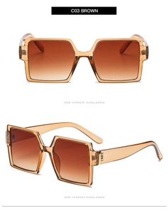 Detail view of oversized square sunglasses in amber brown with gradient lenses