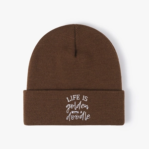 Brown knitted beanie featuring Life Is Golden With A Doodle white embroidery