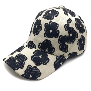Floral jacquard baseball cap in cream with retro flower patterns and adjustable curved brim