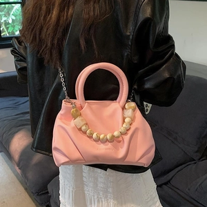 Chic pink pleated cloud bag with marble bead handle and silver chain strap