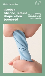 Detail of flexible light blue silicone pouch being twisted to show soft and durable texture