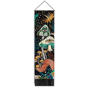 Detailed shot of bohemian mushroom tapestry with colorful psychedelic art and black tassels