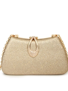 Elegant gold chain evening bag with sparkling texture and rhinestone buckle on white background