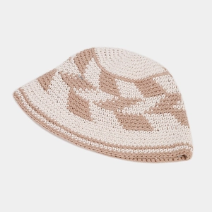 Close-up of handmade crochet bucket hat featuring intricate leaf patterns and dual-tone knit