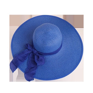 Royal blue wide brim straw sun hat with large bow and frayed edge for beach sun protection