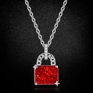 Detailed macro view of a pink high-carbon diamond pendant with silver ice-cut setting