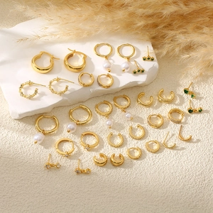 Luxe gold-plated earring set with white pearls and emerald green zircon accents