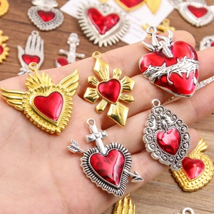 Assorted red enamel heart pendants with gold and silver frames for holiday gift DIY
