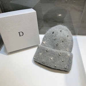 Detail of grey knit hat showing sparkling rhinestones and thick premium wool texture