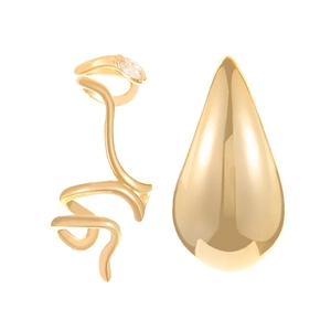 Detailed view of elegant gold-toned ear cuff and stud set with shimmering zircon stone