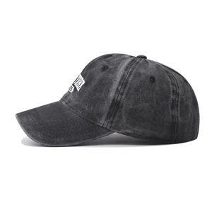 Detail view of washed charcoal grey cotton baseball cap with vintage New York embroidery