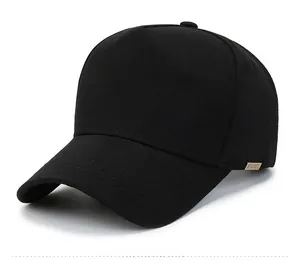 Detail view of the SPORT metal logo on a black cotton twill baseball cap side profile